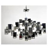 Lot 781  Extra Large Gaetano Sciolari Chandelier. Could use a little polishing. satin nickel accents