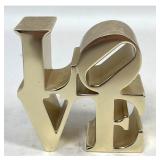Lot 809  Polished Gold Toned Metal Robert Indiana LOVE Desktop Sculpture and Paperweight in Pop Art Style. Un