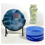 Lot 829  3pc Studio Art Glass lot featuring Iridescent Vase, Fused Glass Plaque, and Wrapped Bowl. One marked