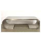 Lot 915  Heavy Stainless Steel Waterfall Bench Coffee Table. Rolled ends. After Marzio Cecchi. 
