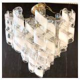 Lot 988  Mid Century Modern Murano style Glass Ribbon Chandelier. Clear Glass Curly Qs with Opaque White Stri