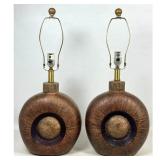 Lot 1111  Pair Brutalist Ceramic Table Lamps with Recessed Medallion and Metallic Glaze. Incised C4515.