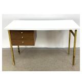 Lot 1136  Arthur Umanoff Style Brass Leg White Laminate Top Desk 3 Drawer Vintage in the manner of McCobb.