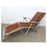 Lot 1275  Vintage folding aluminum and redwood slatted outdoor lounge chair. Mid Century Modern style. Unsigne